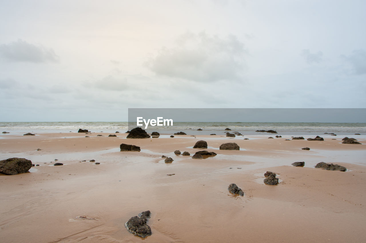 Scenic view of beach against sky