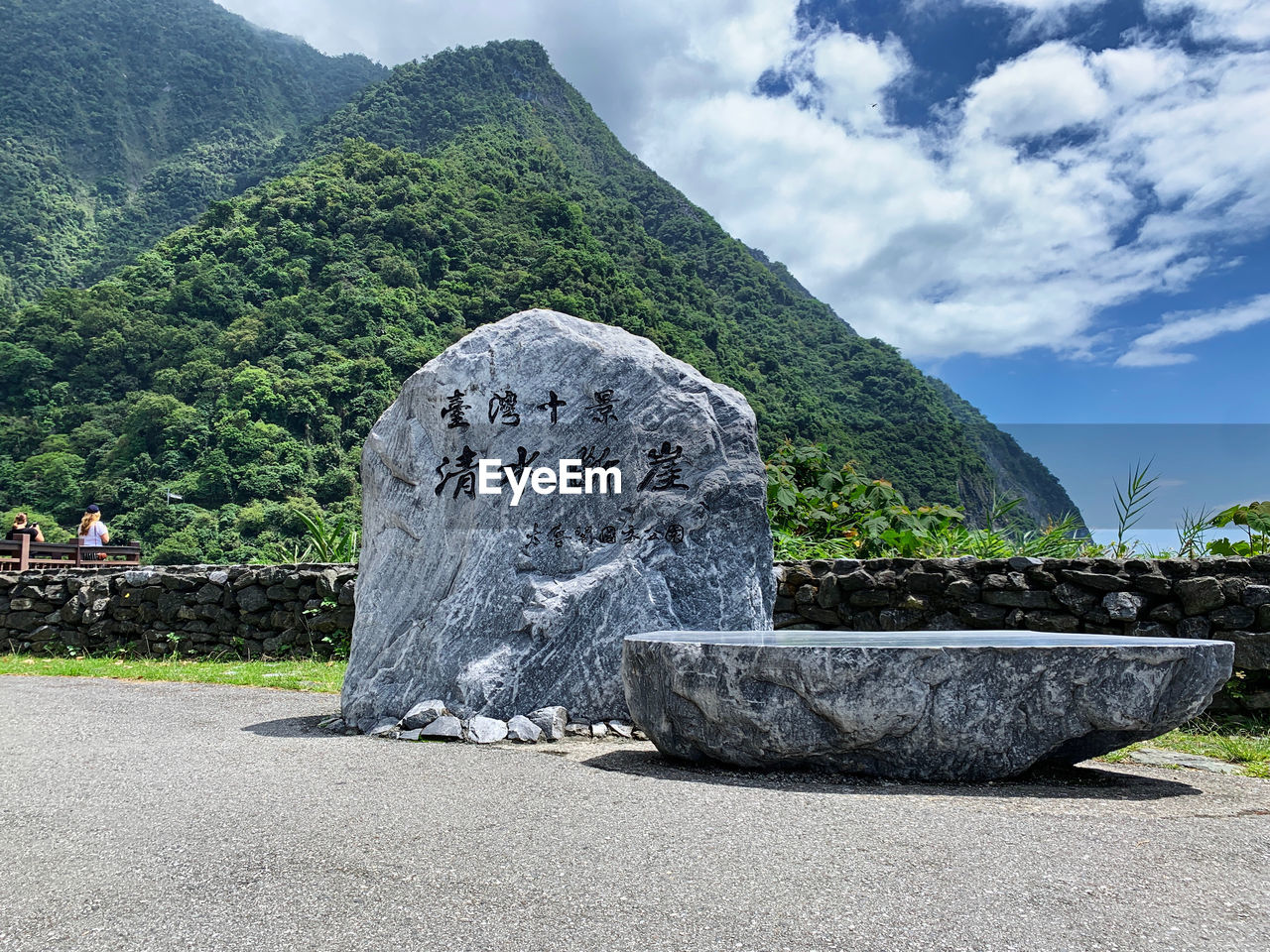 VIEW OF BUDDHA STATUE ON ROCK