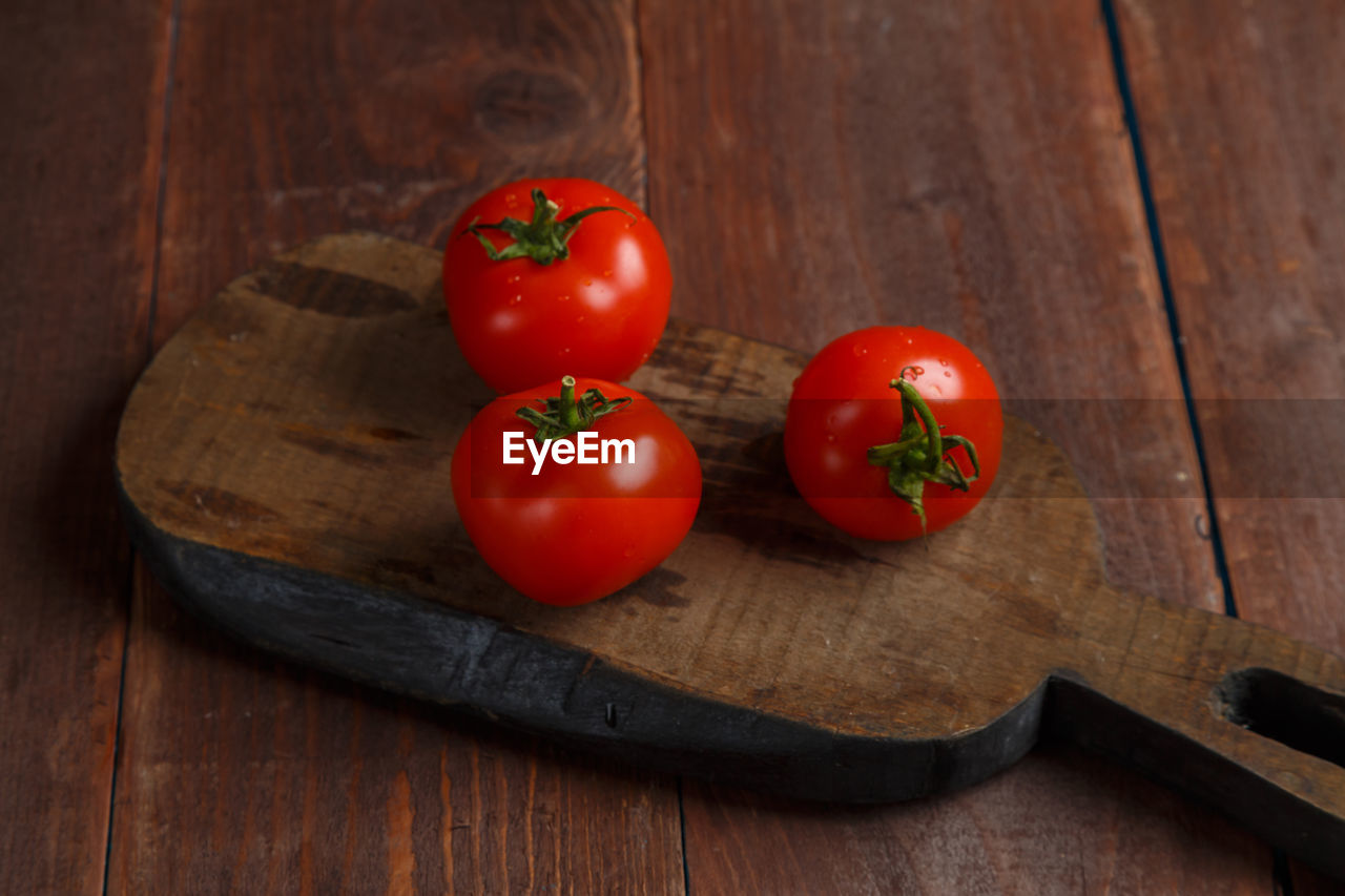 high angle view of tomatoes on wooden table