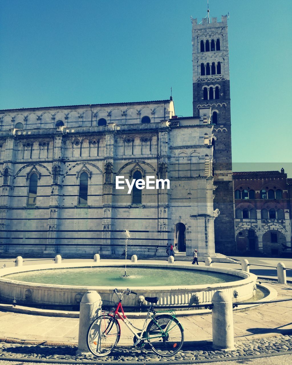 Bicycle in city against clear sky