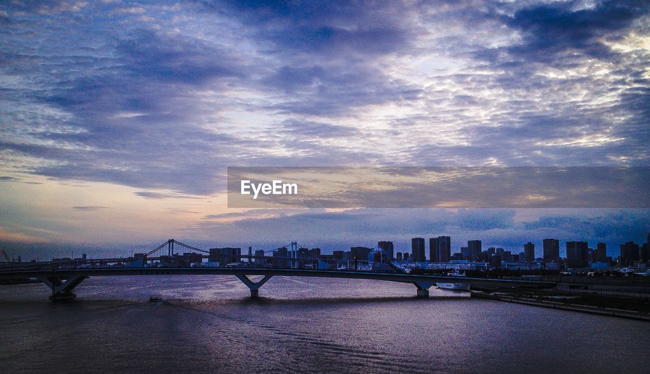 CITYSCAPE AGAINST CLOUDY SKY