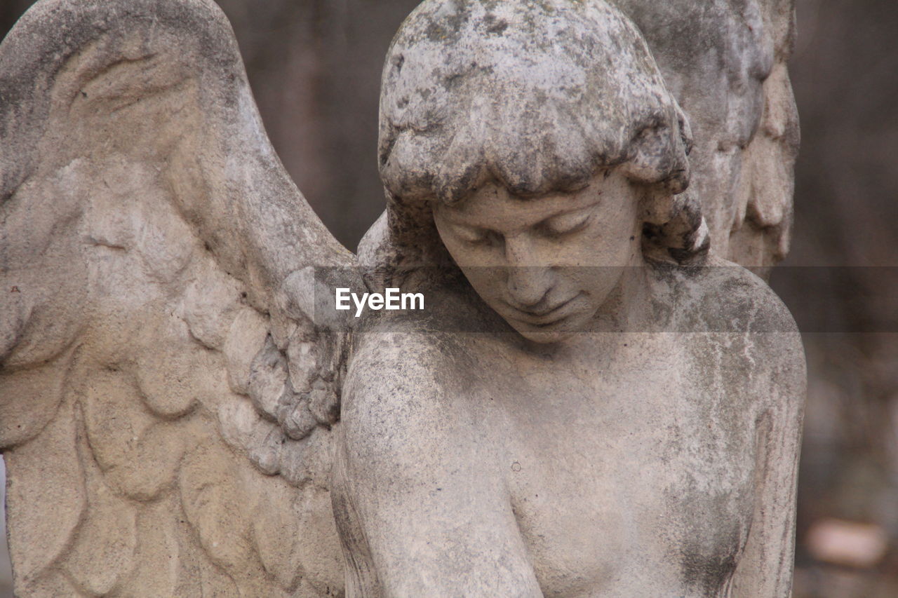 CLOSE-UP OF ANGEL STATUE