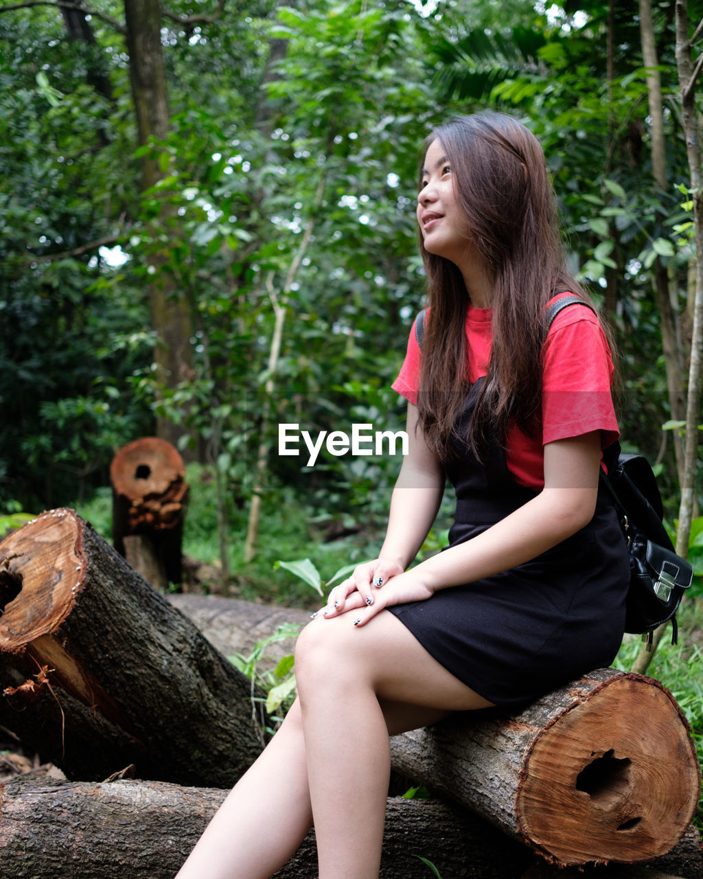 Smiling young woman at park