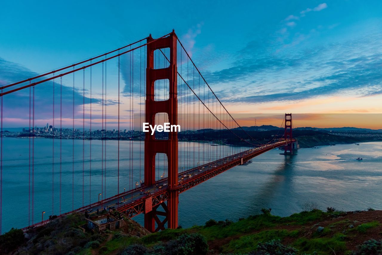 Golden gate bridge against sky during sunset