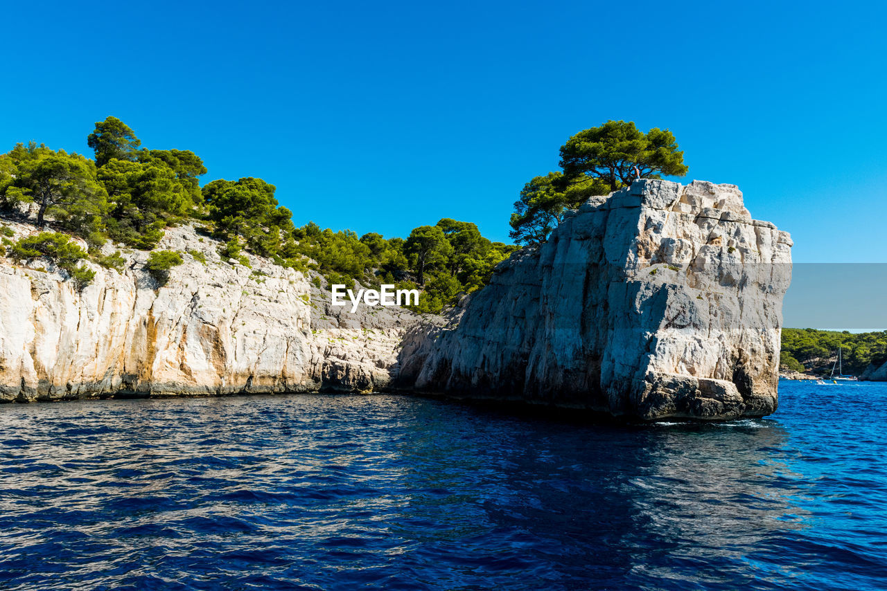 Scenic view of sea against clear blue sky