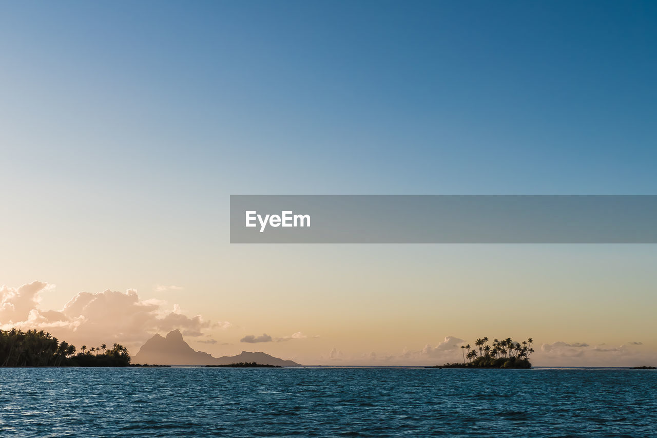 Scenic view of sea against clear sky