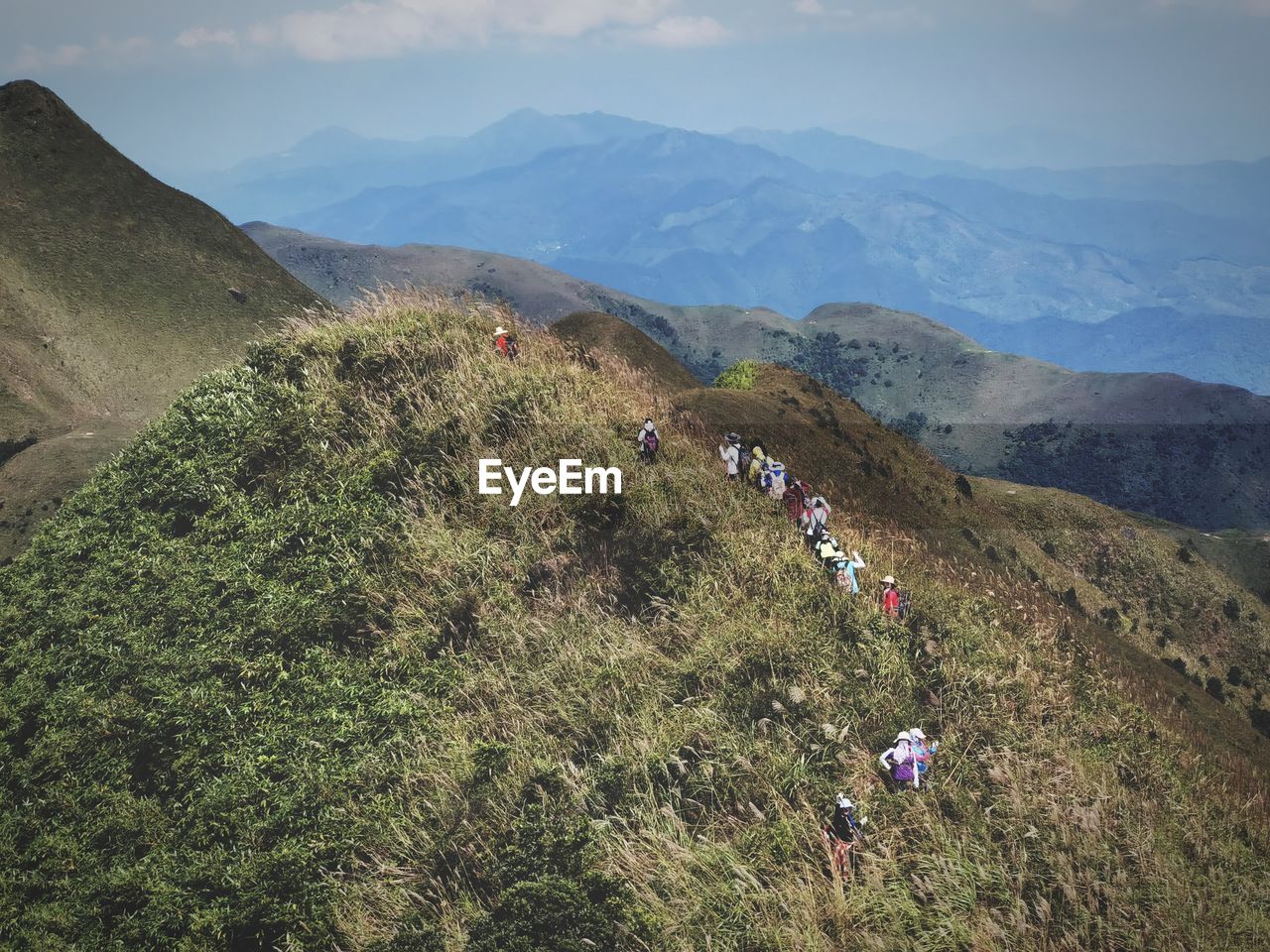 HIGH ANGLE VIEW OF PEOPLE ON LAND