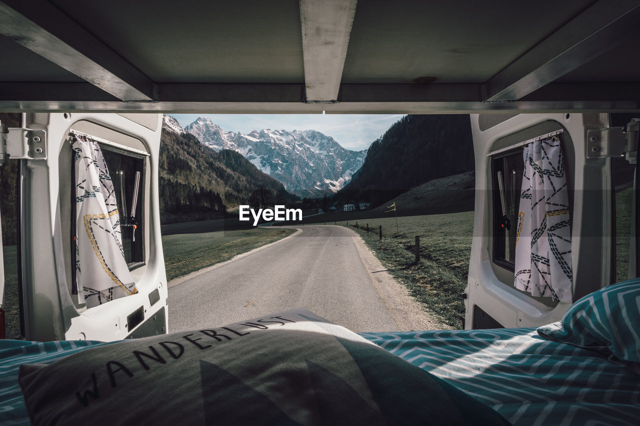 Mountains and road seen through van