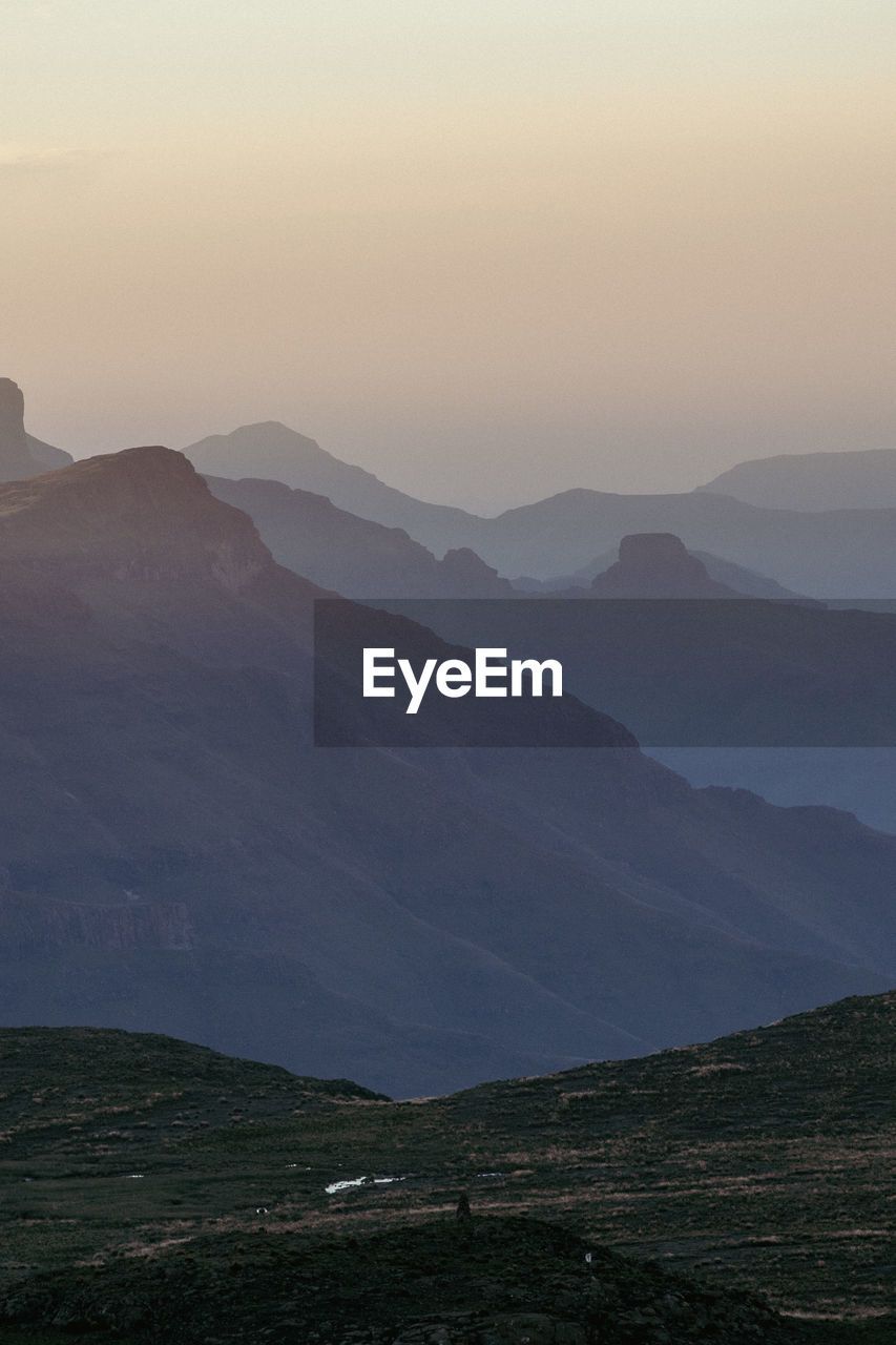 Scenic view of mountains against sky during sunset