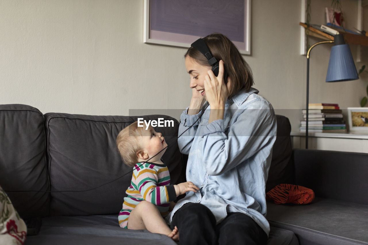 Mother with baby on sofa