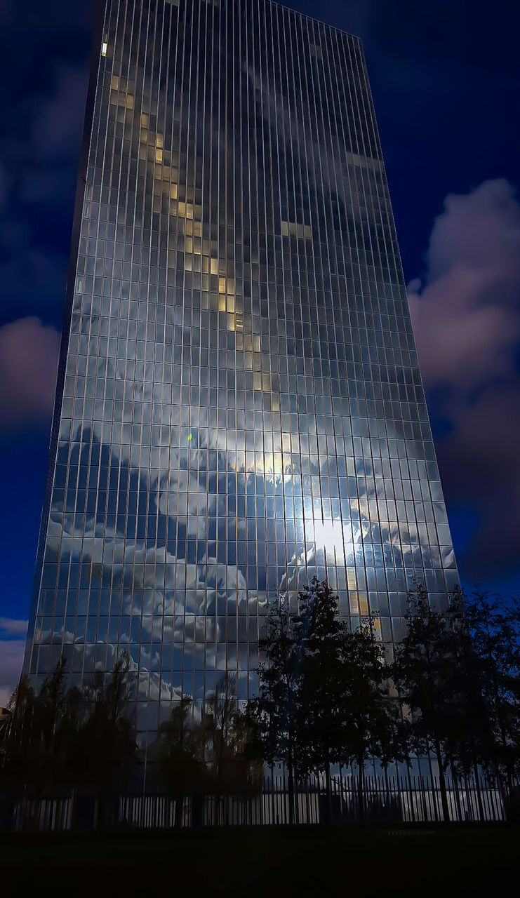 LOW ANGLE VIEW OF ILLUMINATED BUILT STRUCTURE AGAINST SKY