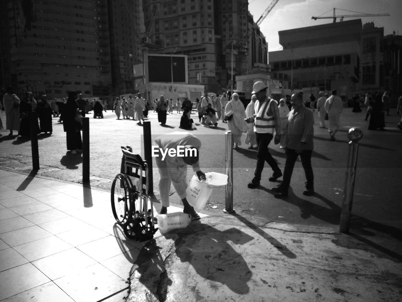 GROUP OF PEOPLE STANDING IN CITY