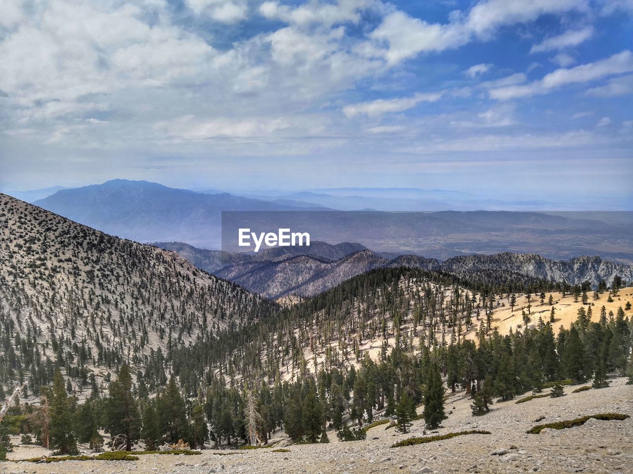 PANORAMIC VIEW OF MOUNTAINS AGAINST SKY