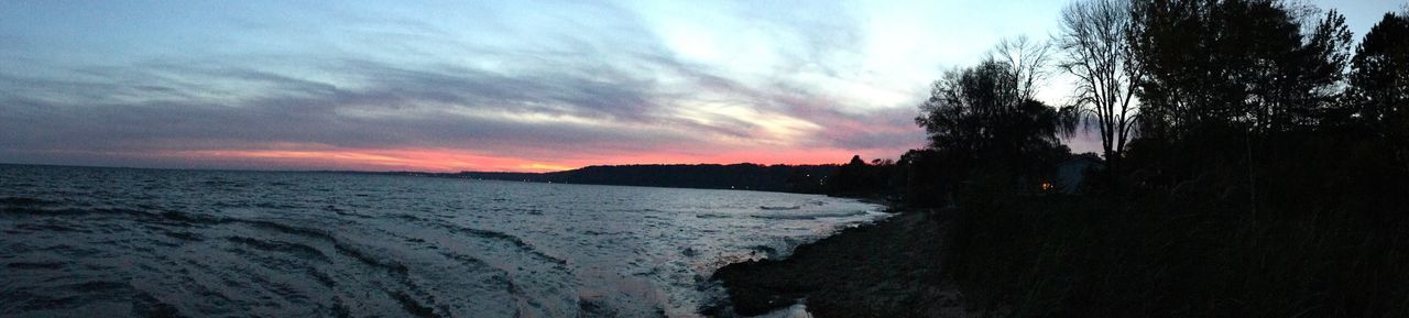 PANORAMIC VIEW OF BEACH AGAINST SKY