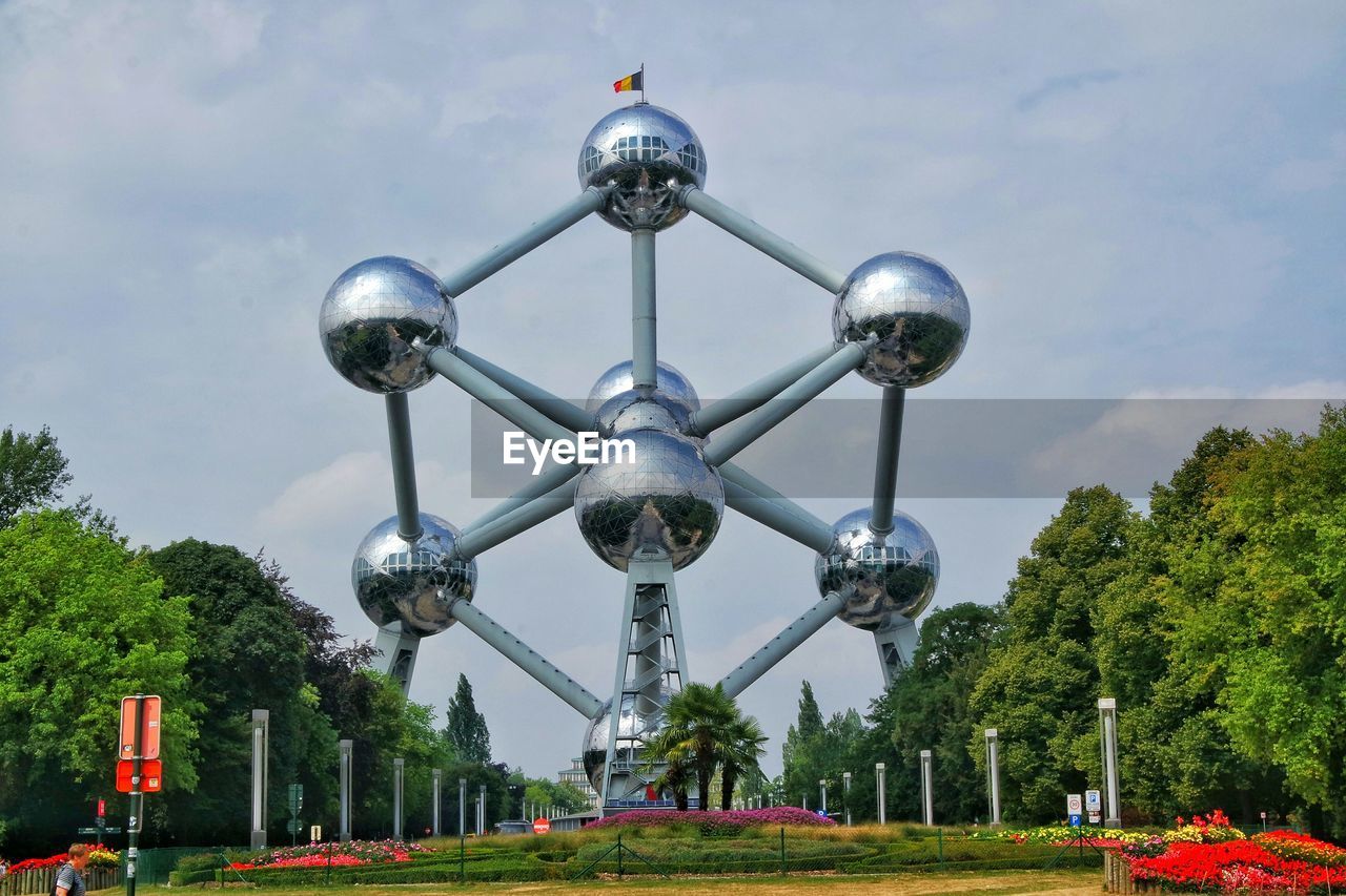 Low angle view of atomium against sky