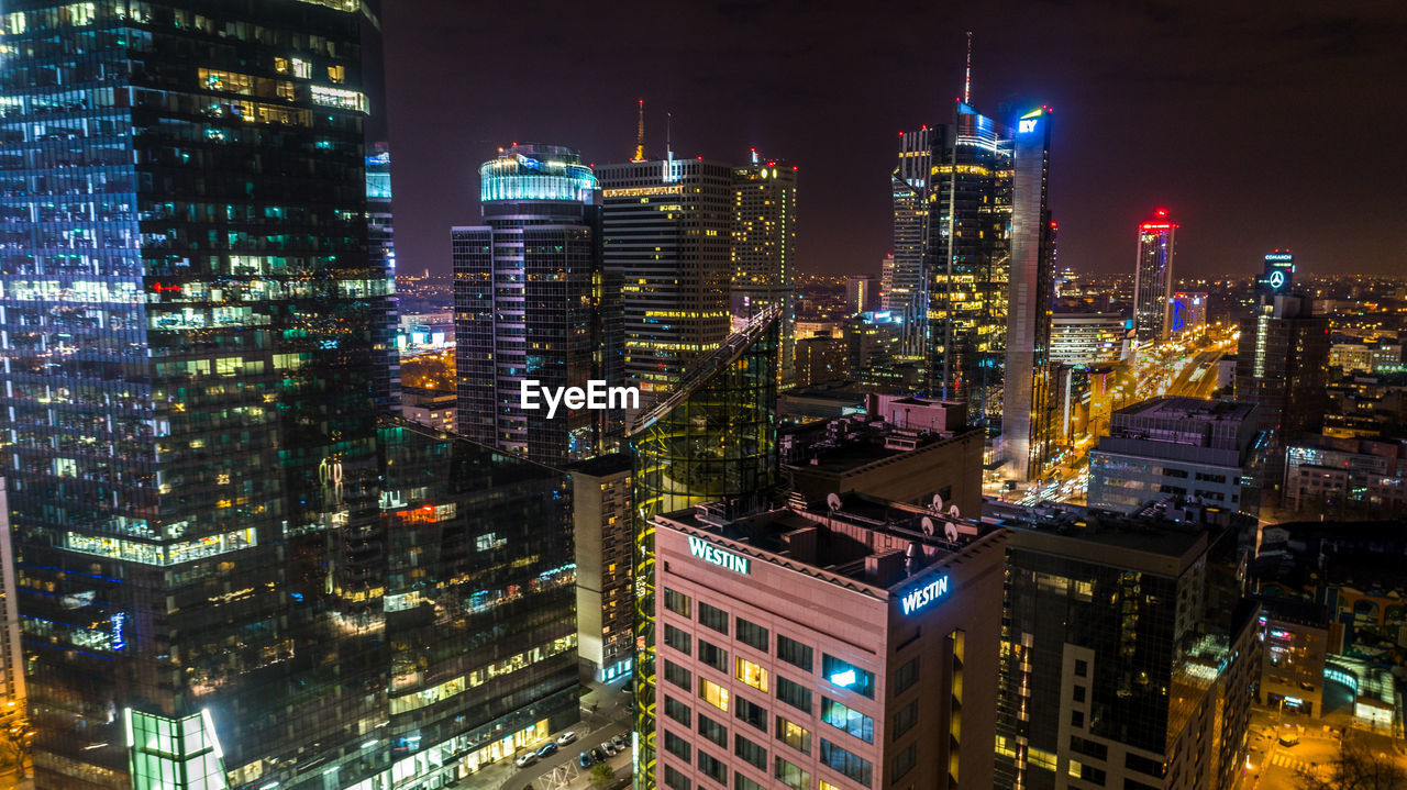 Aerial view of illuminated city at night