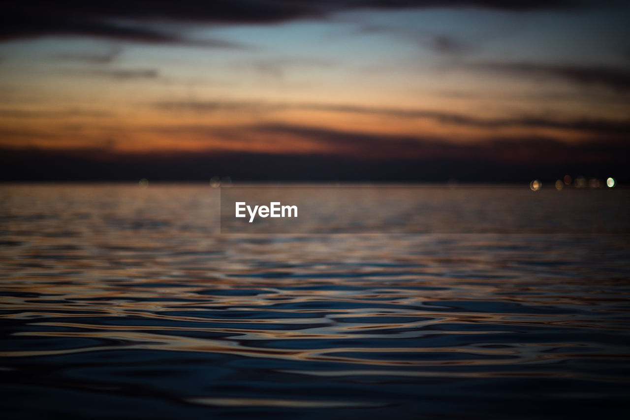 Scenic view of sea against sky at sunset