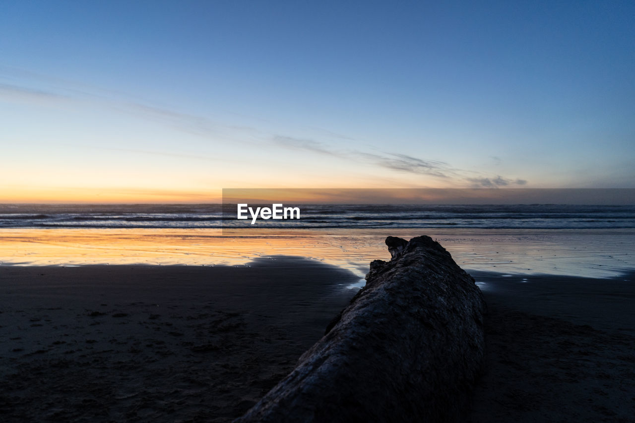 Scenic view of sea against sky during sunset