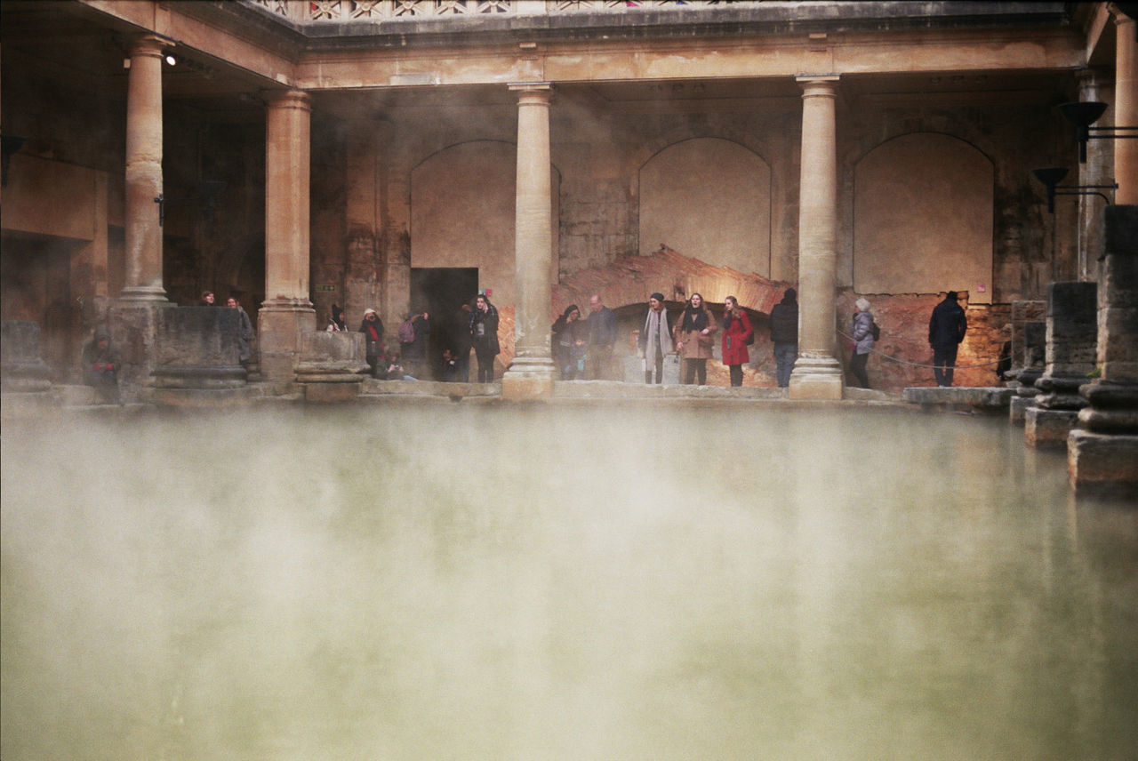 GROUP OF PEOPLE IN FRONT OF TEMPLE