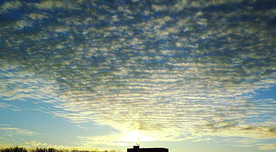 Low angle view of dramatic sky during sunset