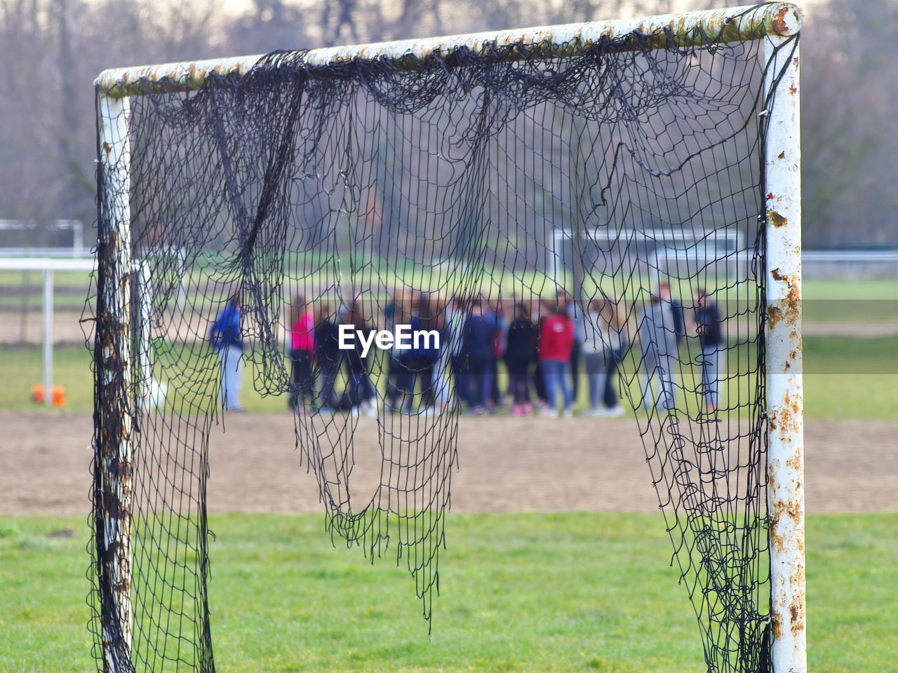 Abandoned soccer goal on playing field