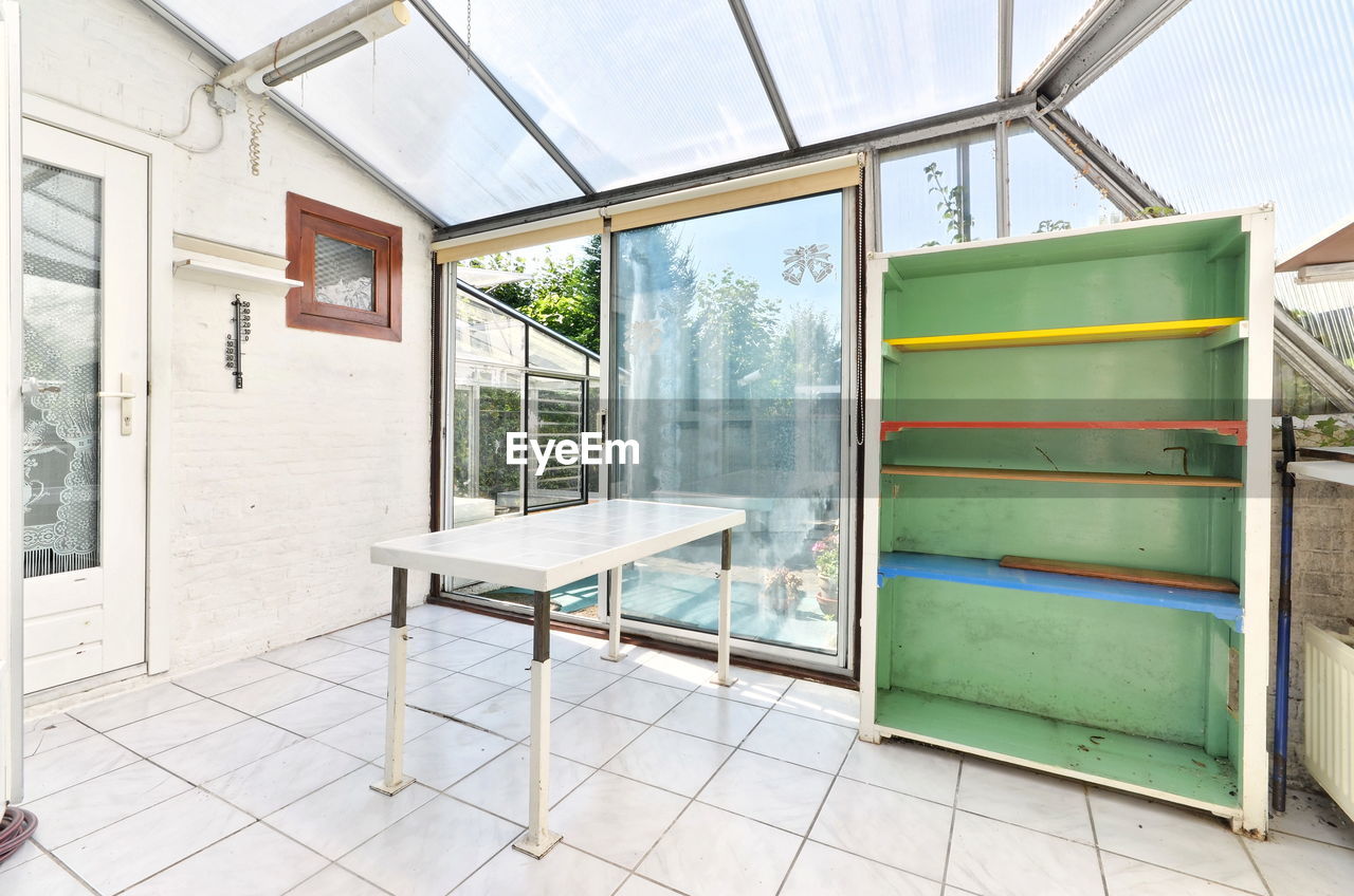high angle view of empty chairs in front of building