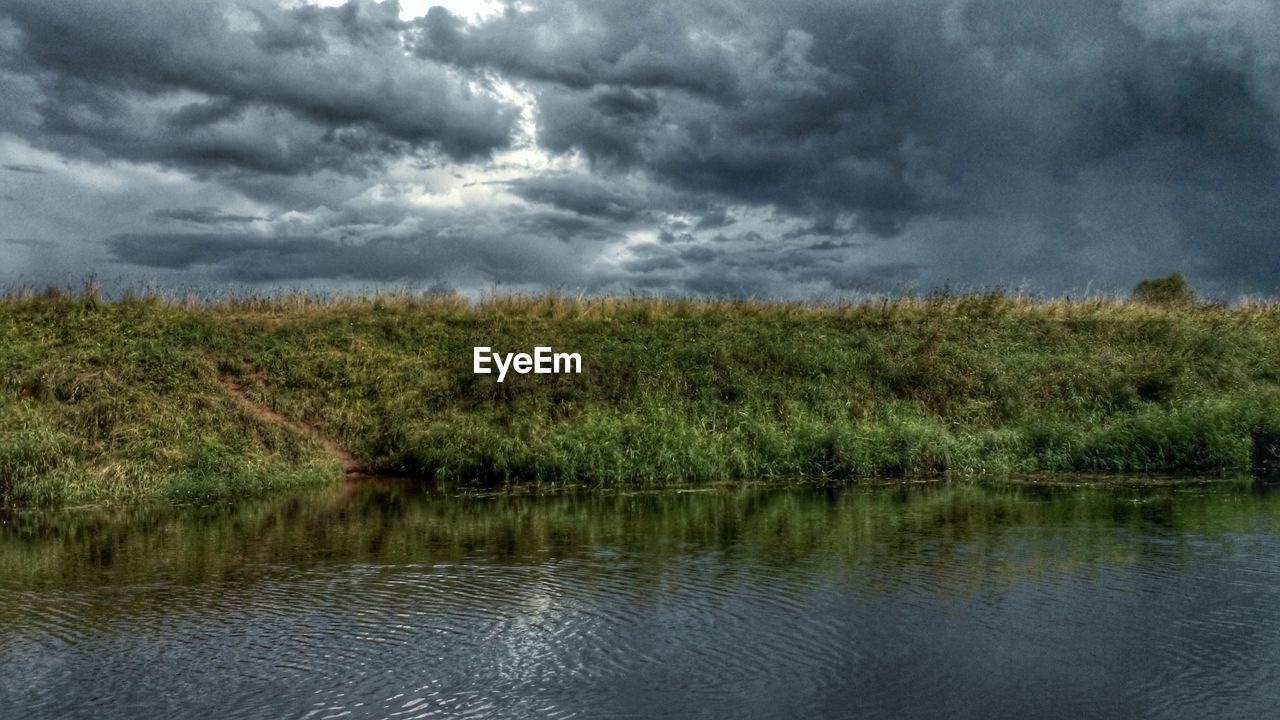 SCENIC VIEW OF LANDSCAPE AGAINST CLOUDY SKY