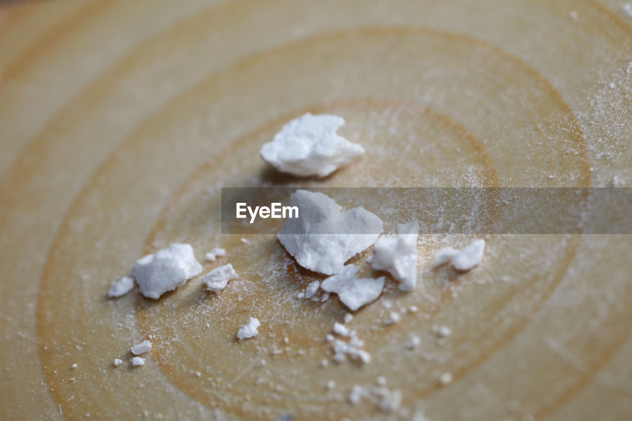 food and drink, food, icing, breakfast, dish, powdered sugar, indoors, close-up, no people, baked, dessert, produce, flour, still life, freshness, table, dough, ingredient, high angle view, powder, whipped cream, selective focus, wood