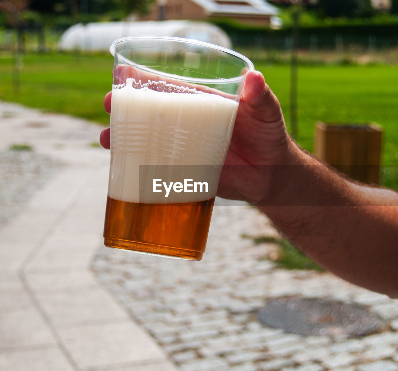 MIDSECTION OF WOMAN DRINKING GLASS