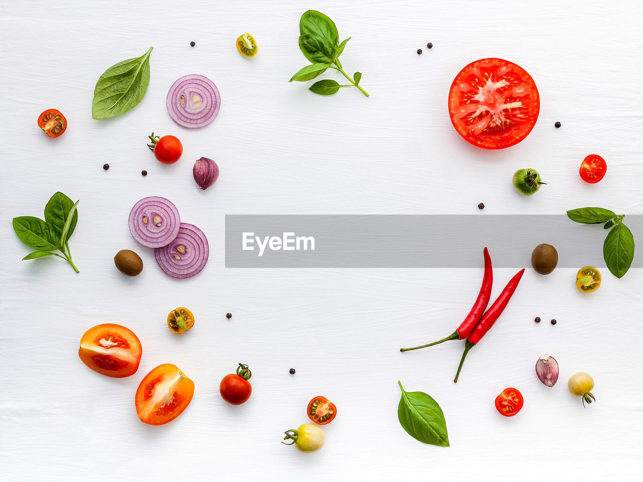 DIRECTLY ABOVE SHOT OF FRUITS ON TABLE AGAINST WHITE BACKGROUND