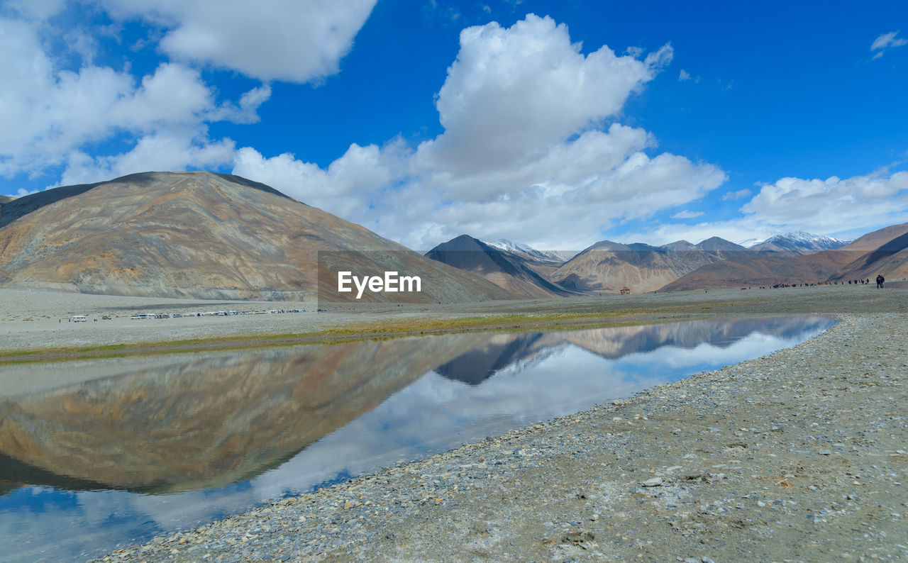 landscape, mountain, environment, scenics - nature, water, sky, cloud, lake, nature, beauty in nature, wilderness, mountain range, land, reflection, reservoir, blue, travel destinations, travel, no people, plateau, valley, tranquility, tranquil scene, non-urban scene, day, outdoors, tourism, panoramic, desert