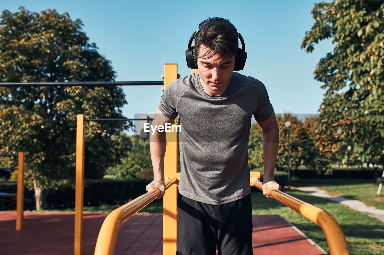 Young man exercising at park