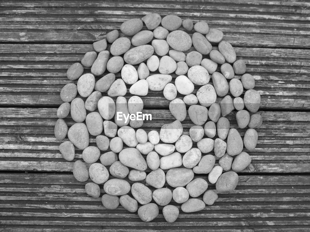 High angle view of stones arranged on wooden table