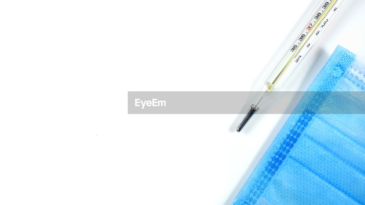 CLOSE-UP OF PEN OVER WHITE BACKGROUND