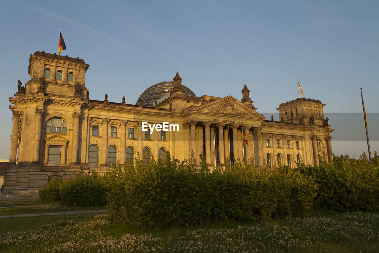The reichstag against sky during sunset