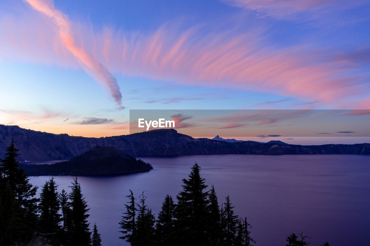 Scenic view of lake against sky during sunset