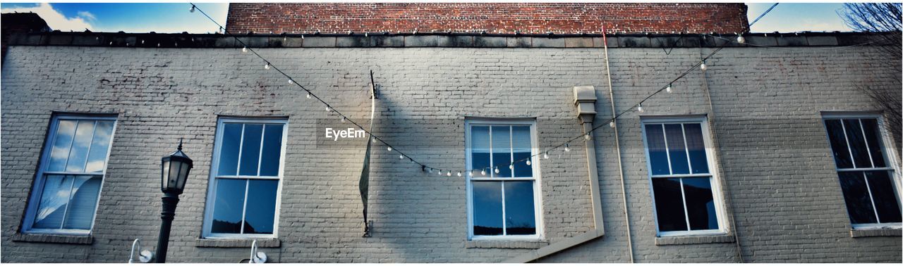 VIEW OF BUILDING THROUGH WINDOW