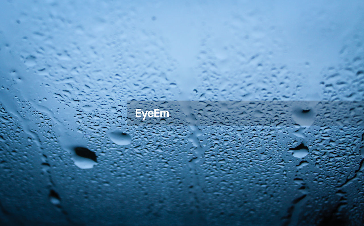 Close-up of raindrop on glass