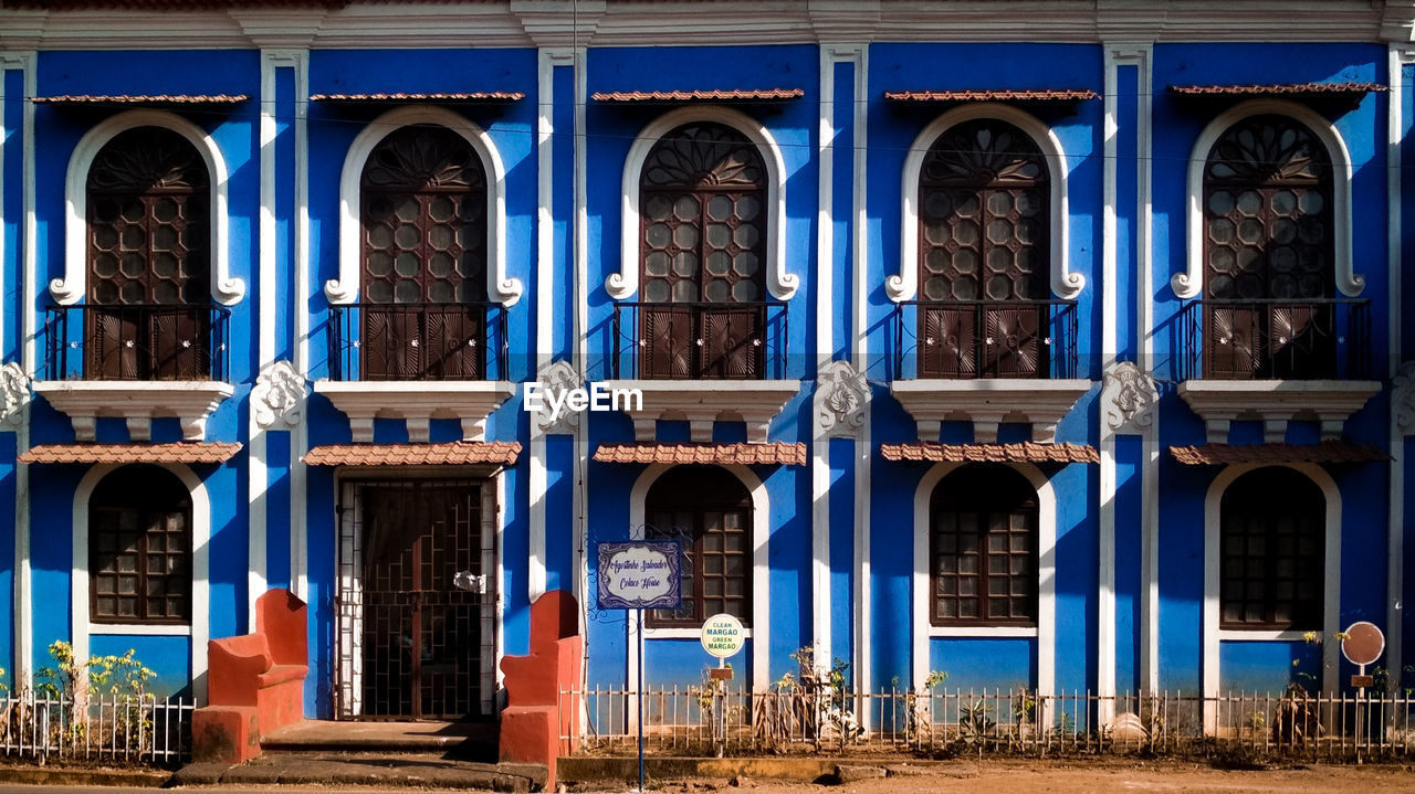 LOW ANGLE VIEW OF BLUE BUILDING