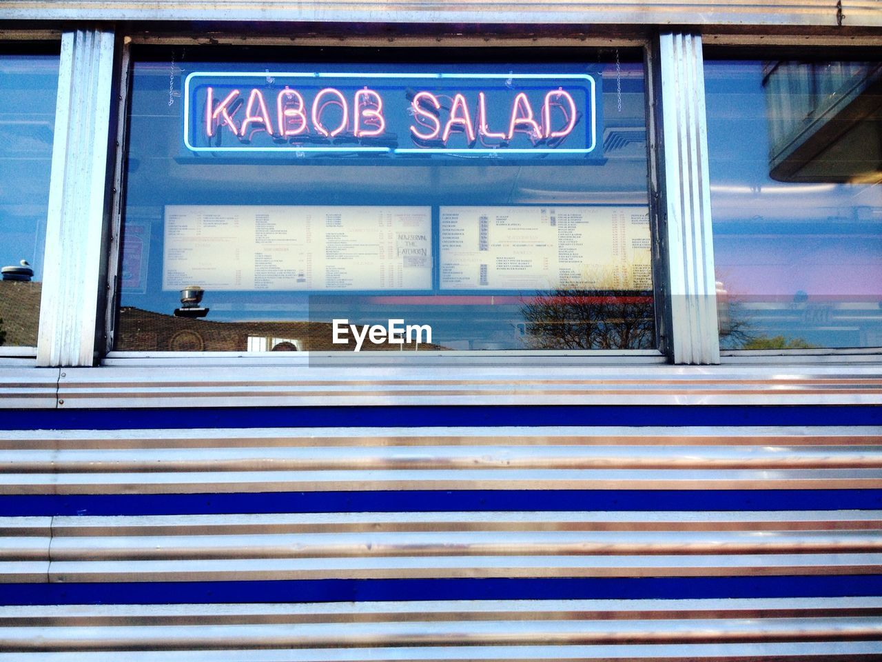 Facade of restaurant with reflection on window