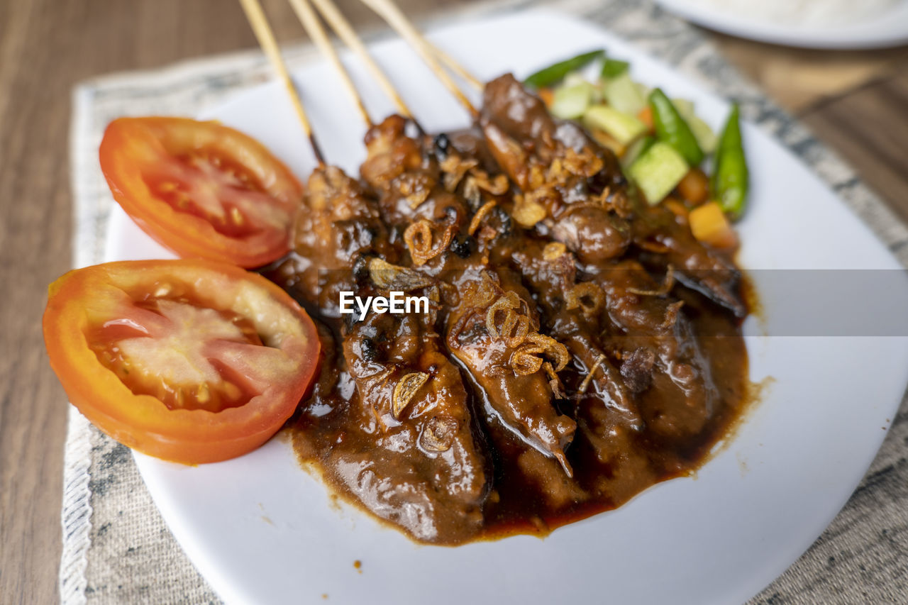 food, food and drink, plate, healthy eating, freshness, wellbeing, dish, meat, vegetable, meal, cuisine, no people, indoors, close-up, table, produce, asian food, fruit, high angle view, eating utensil, seafood, crockery, still life, focus on foreground, savory food, serving size