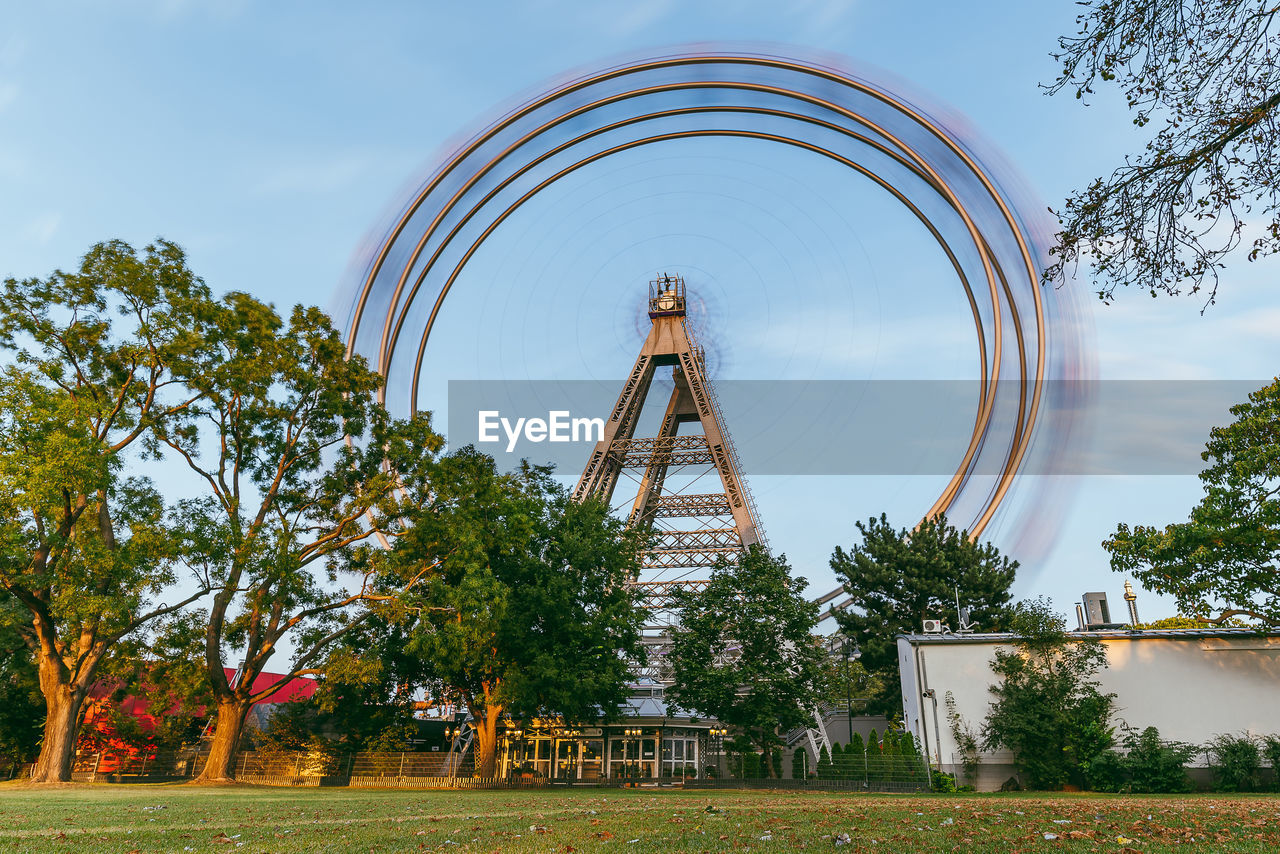 Low angle view of ferris wheel against sky