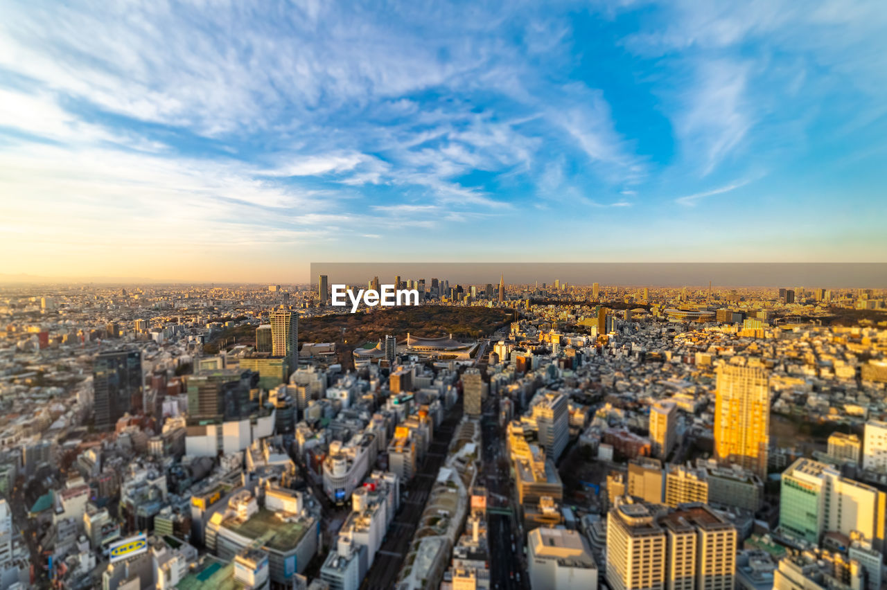 High angle view of city against sky during sunset