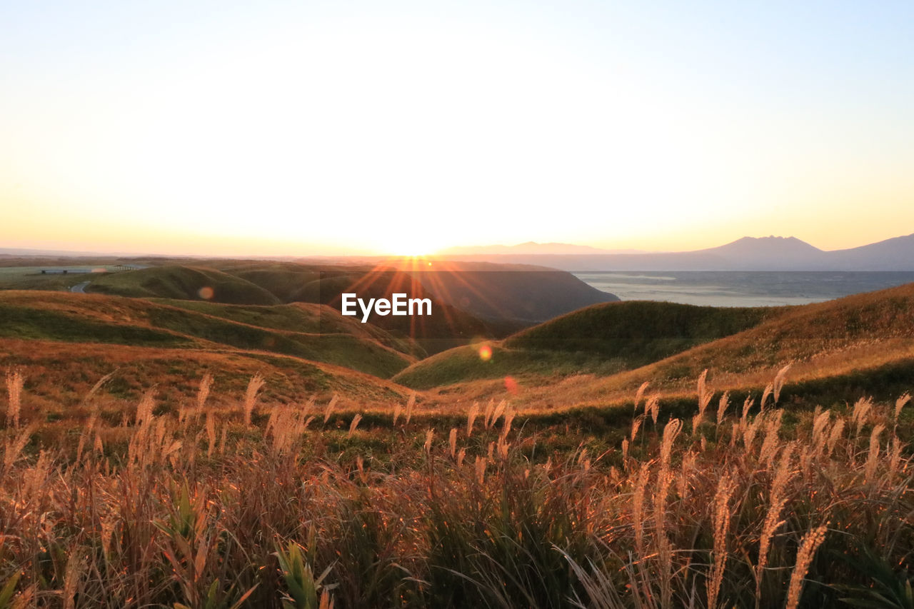 Scenic view of landscape against sky during sunset