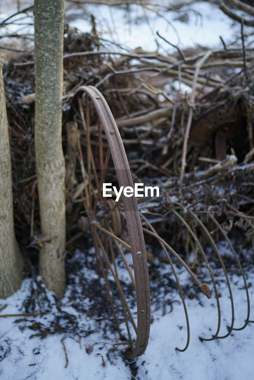 High angle view of rusty wheel of cart during winter