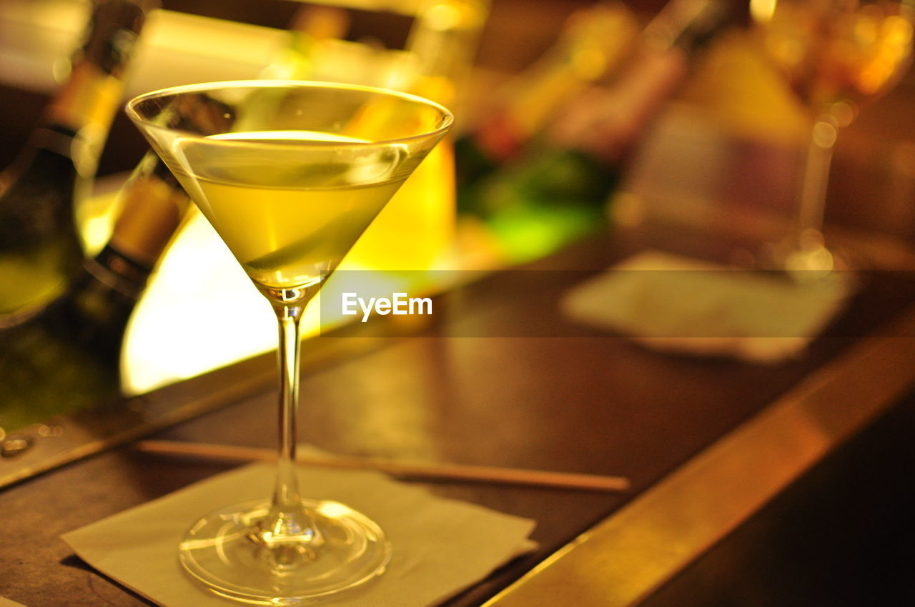 Close-up of martini served on table