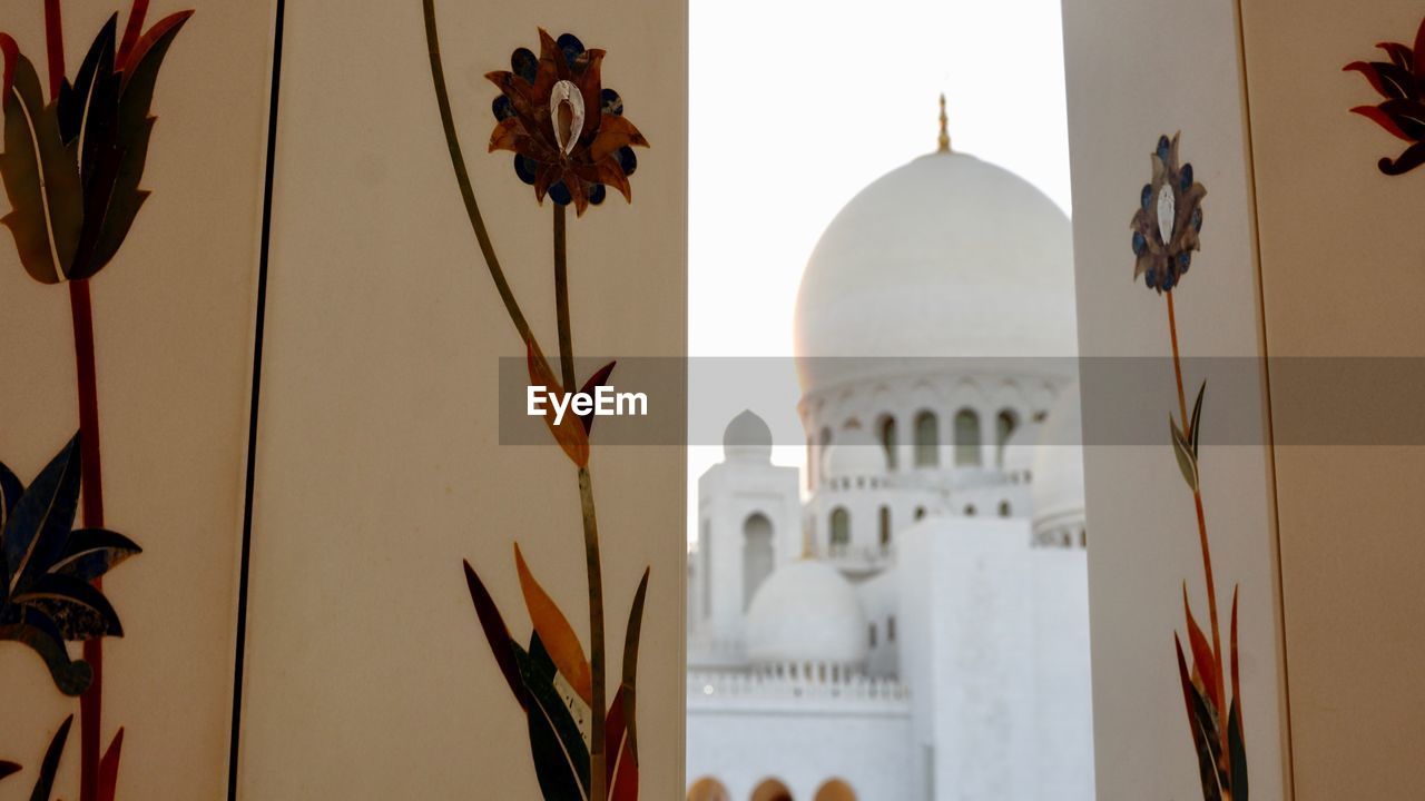 architecture, built structure, religion, building exterior, belief, art, travel destinations, nature, place of worship, spirituality, no people, dome, history, building, lighting, the past, travel, plant, tourism, outdoors, flower, day, tradition