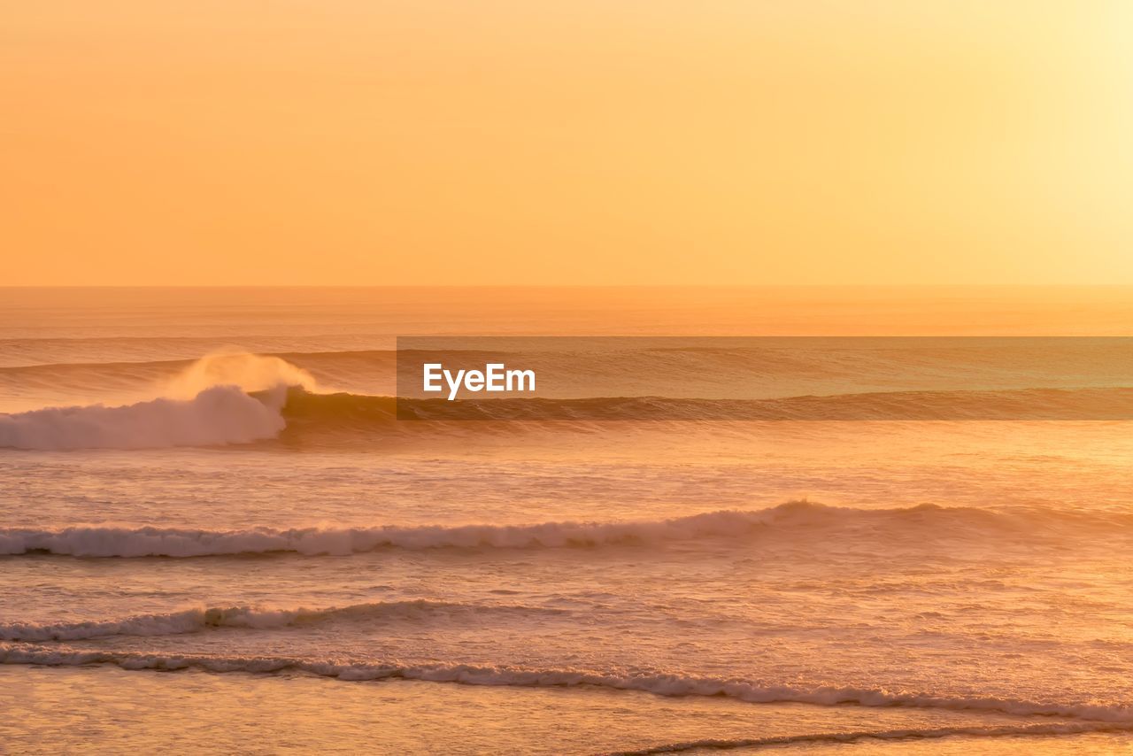 Scenic view of sea against sky during sunset in ulluwatu