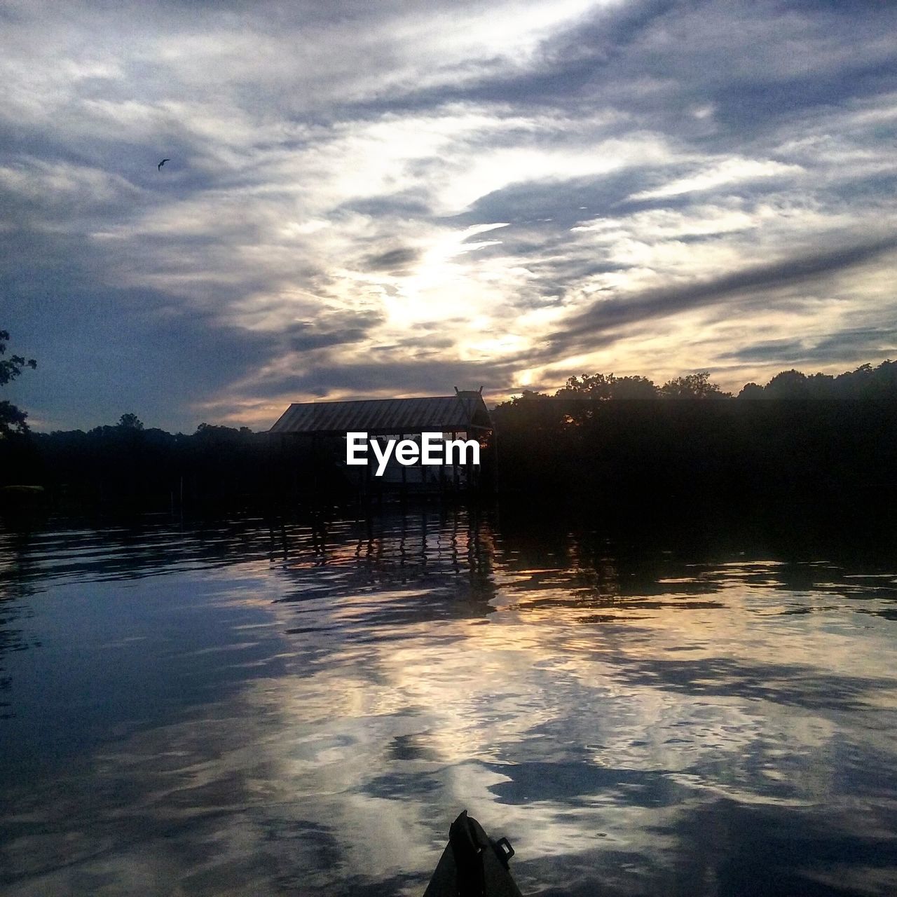 SCENIC VIEW OF CALM LAKE AGAINST SKY