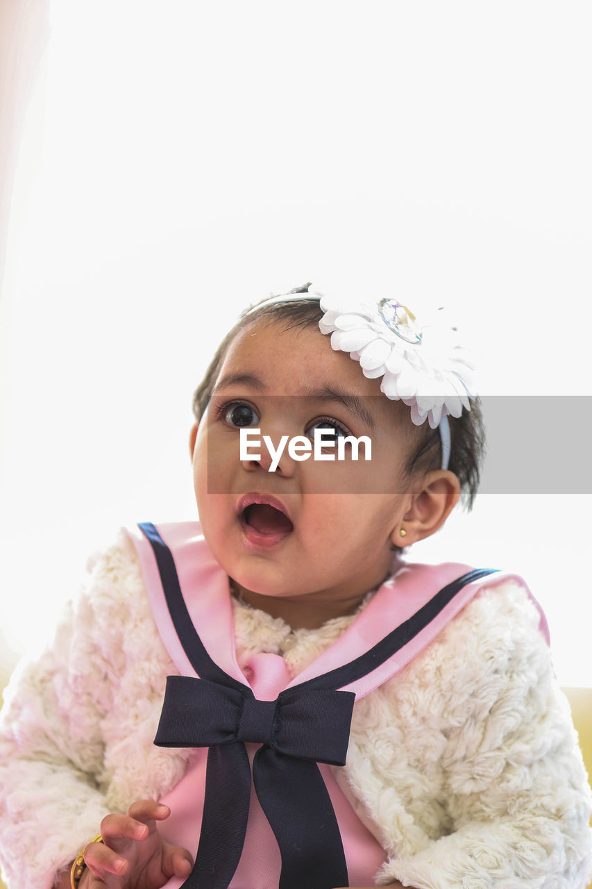 Close-up of cute baby girl wearing headband